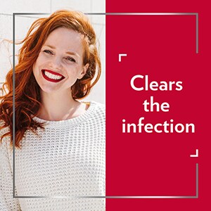 Smiling red-haired womanwith caption ‘’clears the infection’’