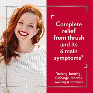 Smiling red-haired woman, with the caption Complete relief from thrush and its 6 main symptoms* *Itching, burning, discharge, redness, soreness and swelling.
